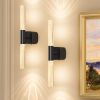 Modern wall sconces beside framed artwork