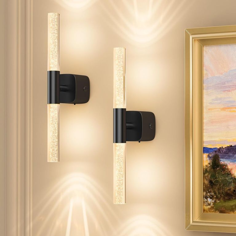 Modern wall sconces beside framed artwork