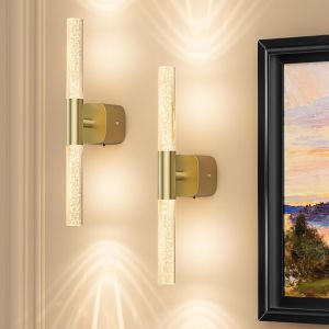 Modern brass wall sconces with glowing glass tubes
