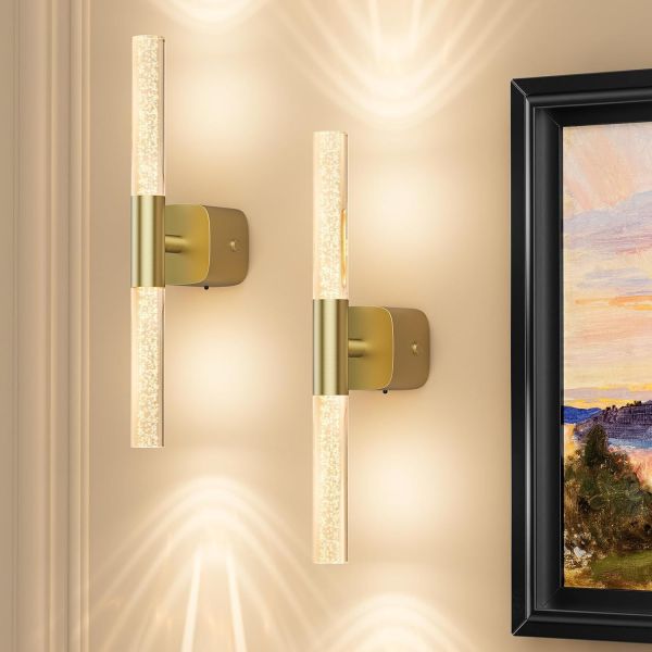 Modern brass wall sconces with glowing glass tubes