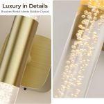 Brushed gold wall light with bubble crystal