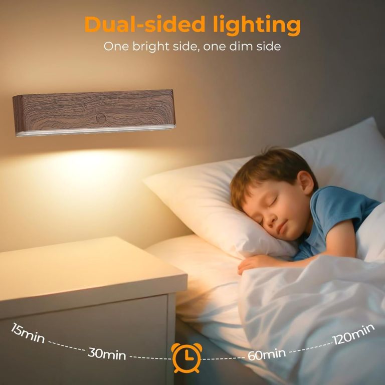 Child sleeping beside dual-sided wall night light