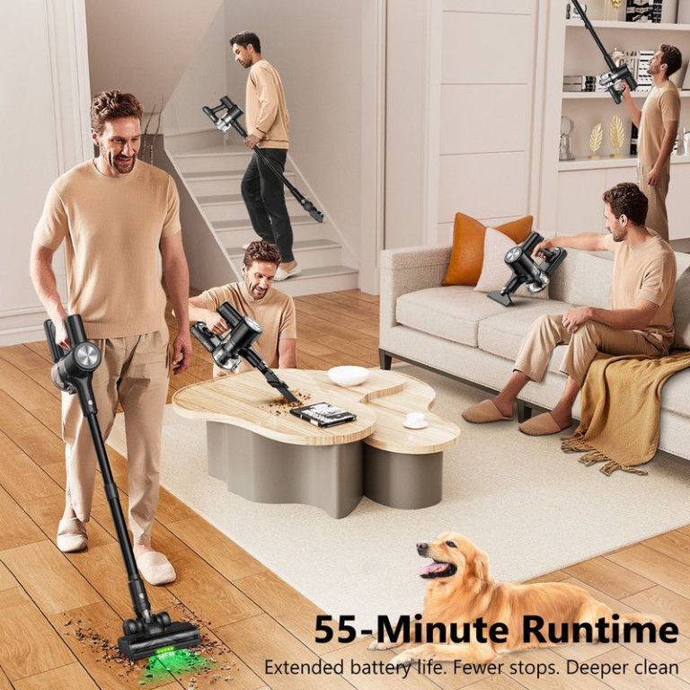 Man vacuuming living room with cordless stick vacuum