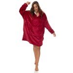 Woman wearing oversized red plush hoodie indoors