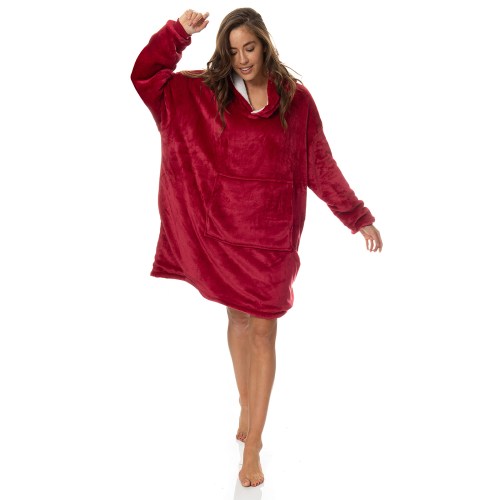 Woman wearing oversized red plush hoodie indoors