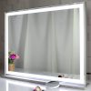 LED vanity mirror with touch controls on dresser