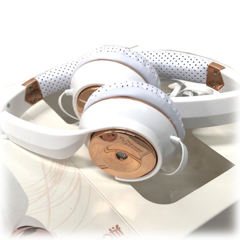 White and rose gold over-ear headphones close-up