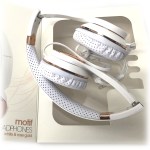 White and rose gold over-ear headphones in box