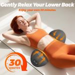 Woman using lower back massager at home