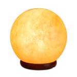 Glowing Himalayan salt lamp on wooden base