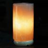 12v 12w cylinder himalayan pink salt lamp carved rock crystal light bulb on/off Glowing cylindrical Himalayan salt lamp on dark background