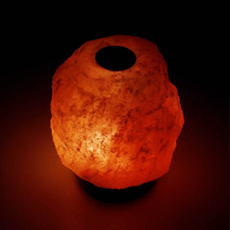 12v 12w 3 5kg himalayan pink salt diffuser essential oil lamp aromatherapy on/off Glowing Himalayan salt lamp against dark background