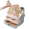 makeup display case organiser cosmetic storage jewellery portable vanity Hand placing skincare bottle into cosmetic organiser