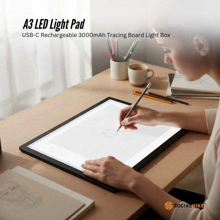 Artist using A3 LED light pad for tracing