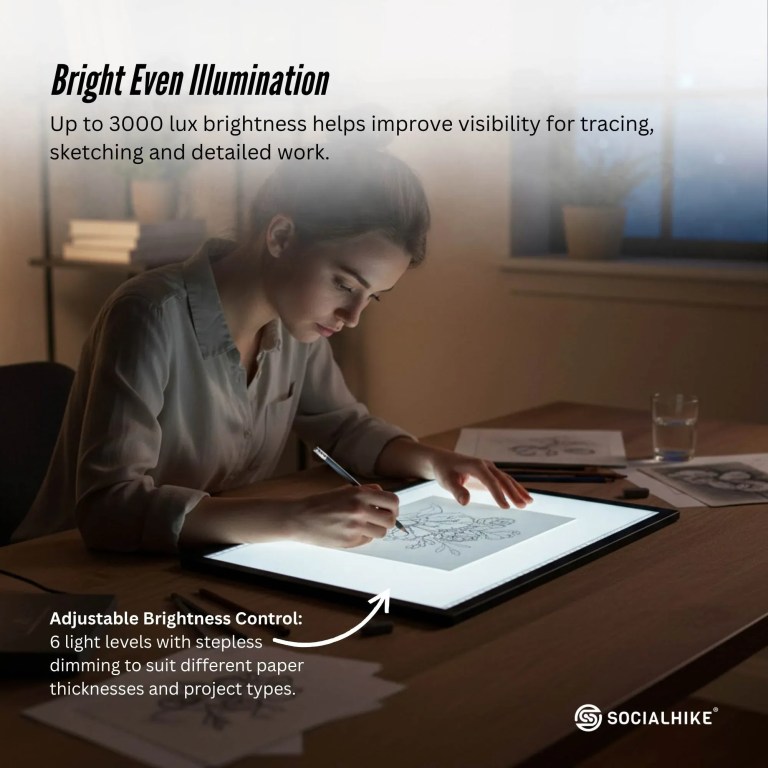 Artist drawing on bright adjustable light pad