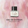 Foellie Inner Beauty perfume bottle on pink background