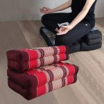 3 fold zafu meditation cushion medium size red Stacked Thai floor cushions with person meditating