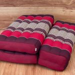 3 fold zafu meditation cushion medium size red Folded red Thai floor cushions on wooden floor