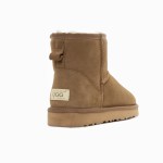 Tan suede UGG ankle boot with shearling lining