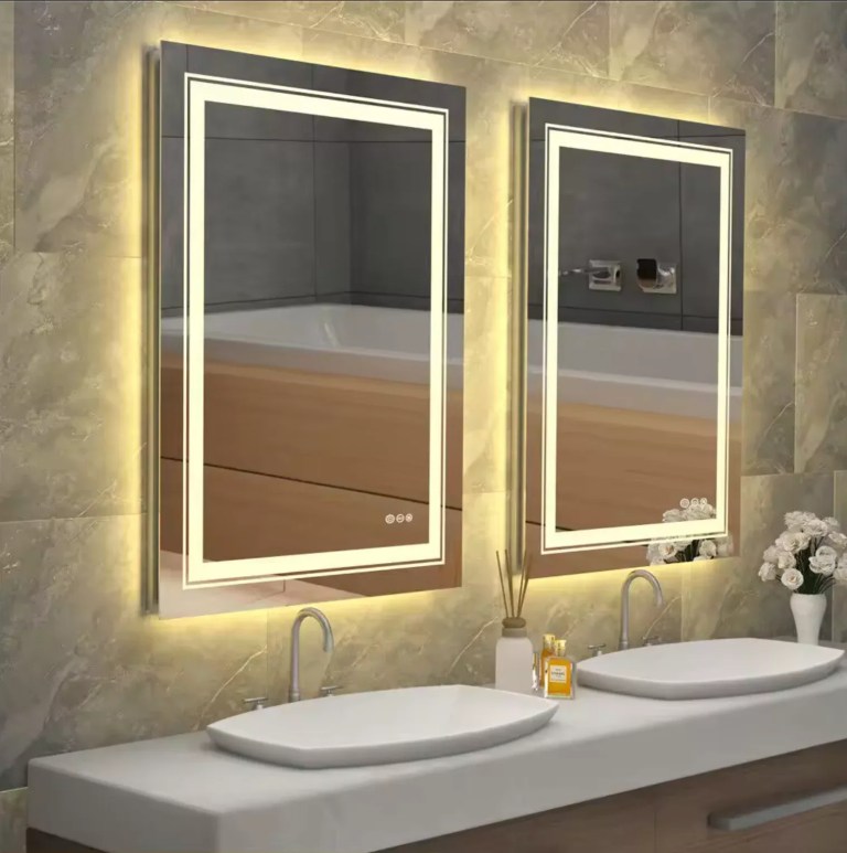 Modern bathroom with LED backlit mirrors