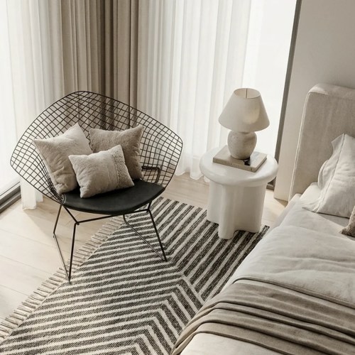 v355 ia st san ivo 00.webp Minimalist living room with wire chair and rug