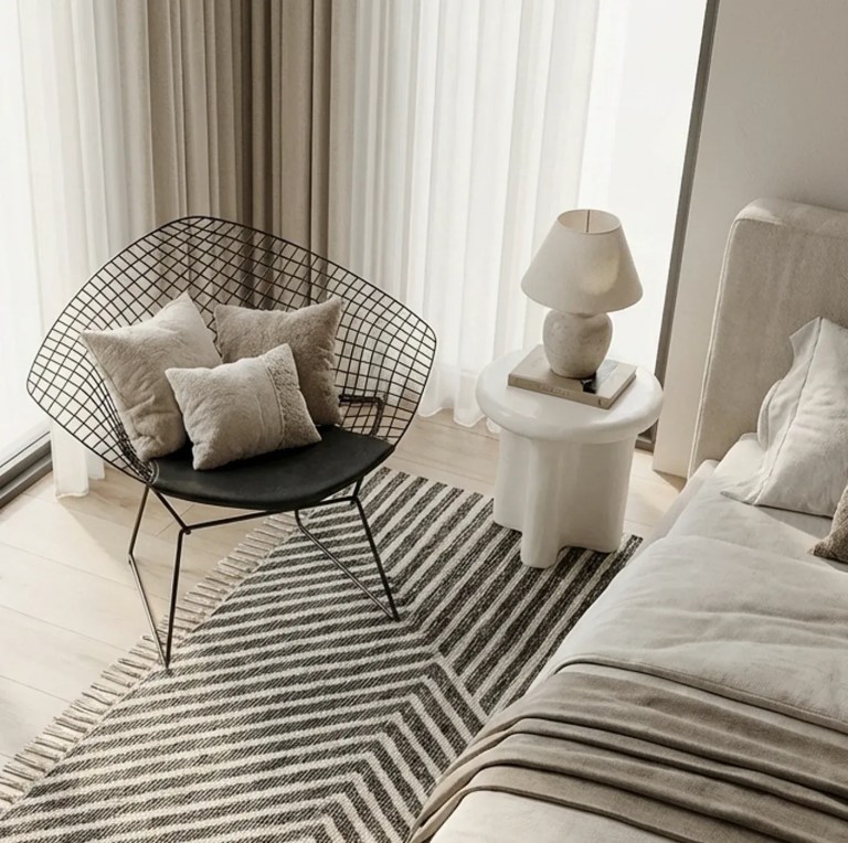v355 ia st san ivo 00.webp Minimalist living room with wire chair and rug
