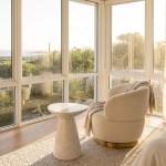Sunlit armchair by window with coastal view