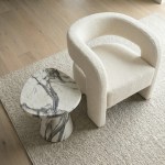 interior ave veneta stone side table panda marble finish Cream boucle armchair beside marble side table