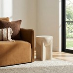 Modern sofa and sculptural stone side table