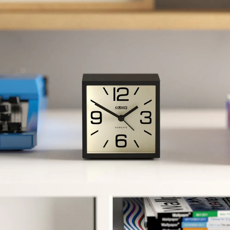 newgate cube mantel clock black Black square analogue clock on white shelf