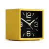 Yellow cube alarm clock with black face