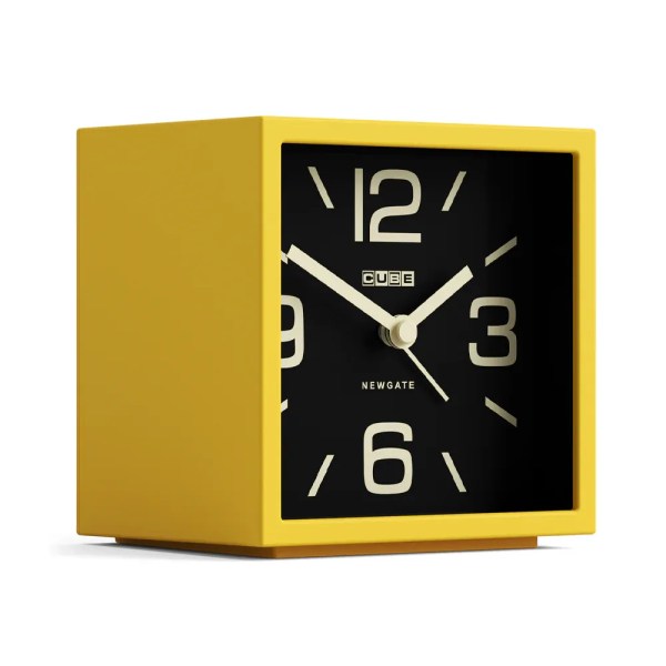 Yellow cube alarm clock with black face