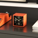 newgate cube mantel clock pumpkin orange Orange cube desk clock on dark table