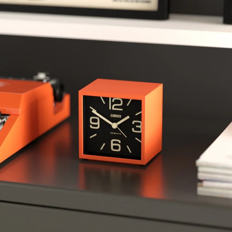 newgate cube mantel clock pumpkin orange Orange cube desk clock on dark table