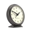 Dark grey analogue mantel clock on white background