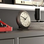 newgate pacific mantel clock graphite Modern analog clock on shelf with books