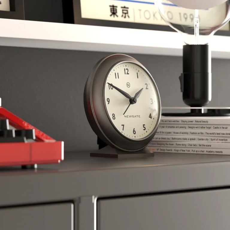 newgate pacific mantel clock graphite Modern analog clock on shelf with books