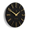 Black and gold oval wall clock