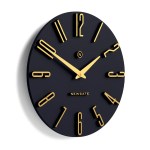 Black oval wall clock with gold numerals