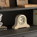 newgate broadway mantel clock vanilla cream White mantel clock on dark wooden shelf