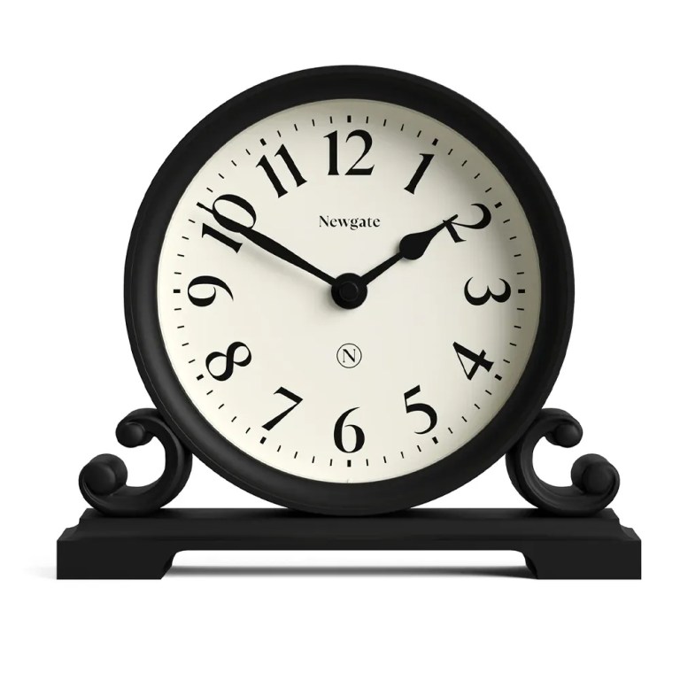 Black mantel clock showing ten past ten