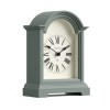 Sage green arched mantel clock with Roman numerals