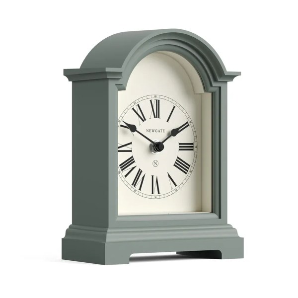 Sage green arched mantel clock with Roman numerals