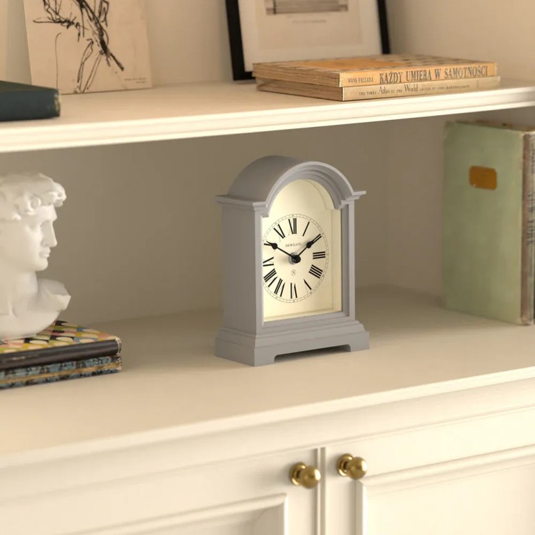 newgate fillmore mantel clock clockwork grey Classic mantel clock on cream bookshelf
