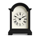 Black arched mantel clock with Roman numerals