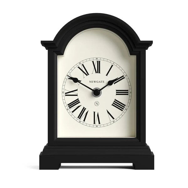 Black arched mantel clock with Roman numerals