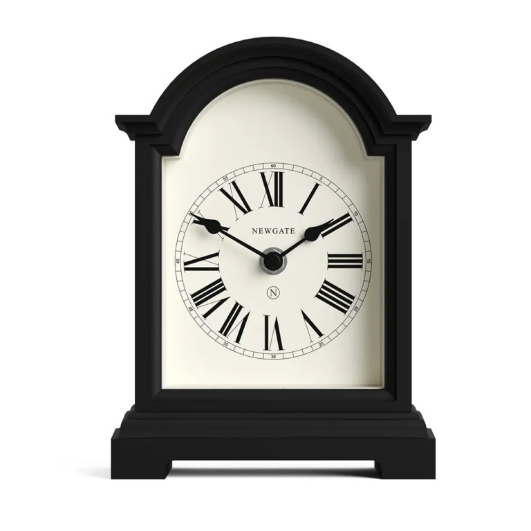 Black arched mantel clock with Roman numerals