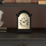 Black mantel clock with Roman numerals on shelf