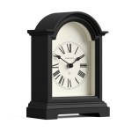 Black arched mantel clock with Roman numerals