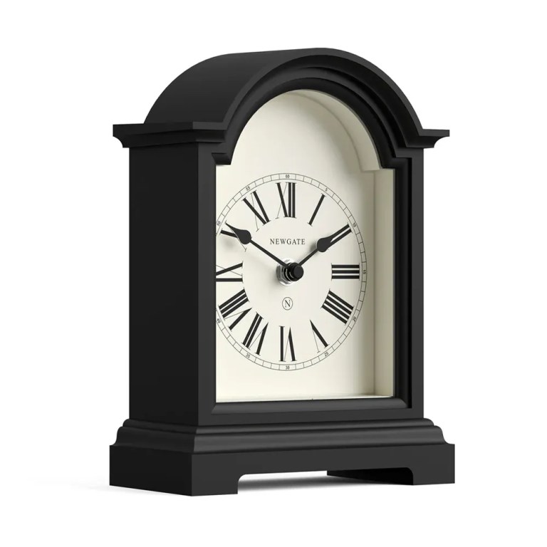 Black arched mantel clock with Roman numerals